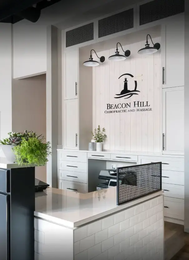 Chiropractic clinic reception desk and custom millwork by Can Do More in Calgary