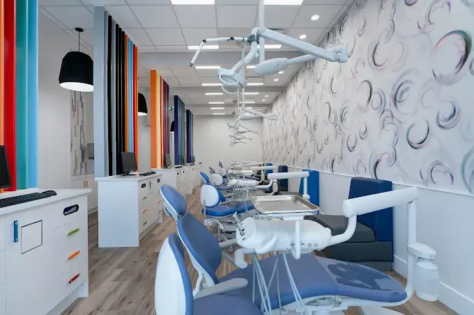 Dental clinic renovation with an open treatment bay and custom cabinetry in Calgary
