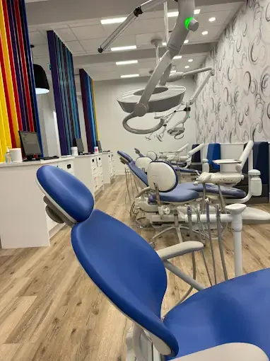 Dental operatory renovation with blue treatment chairs and durable vinyl flooring in Calgary
