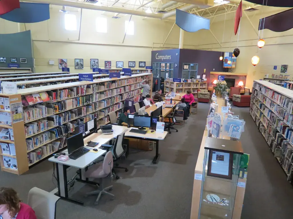 Library computer and study area renovation with commercial flooring and shelving in Calgary