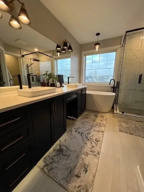 Santos ensuite bathroom after renovation with freestanding tub and walk-in shower